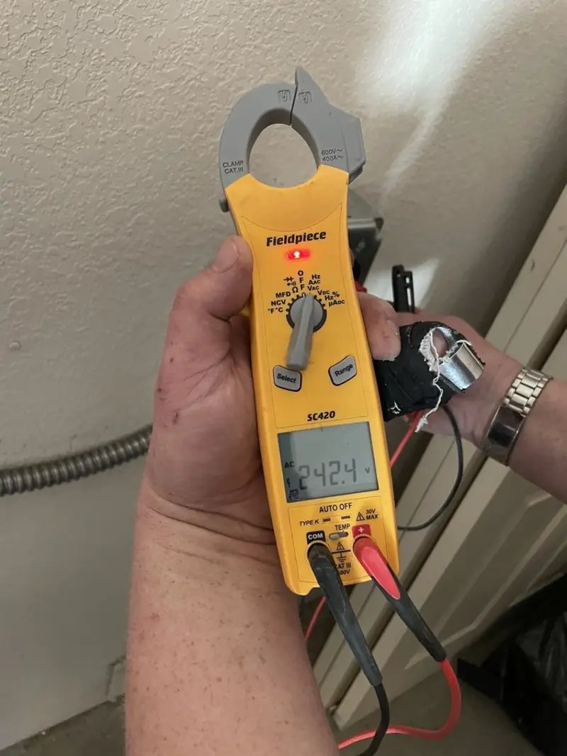 Voltage testing with clamp meter during Recessed Lighting Installation in Pendleton